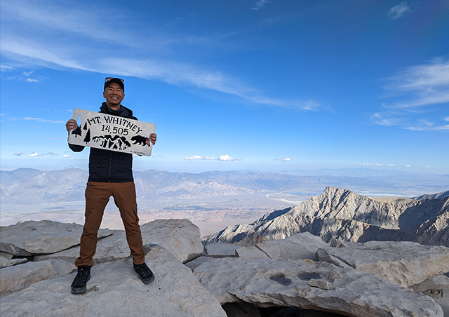 Standing at the top of Mount Whitney in California